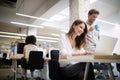 Cheerful coworkers in office during company meeting Royalty Free Stock Photo