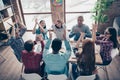 Cheerful coworkers guys partners race clapping hands applauding having aims celebrating professional in casual shirts in Royalty Free Stock Photo