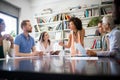 Cheerful coworkers in office during company meeting Royalty Free Stock Photo