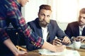 Cheerful coworkers in office during company meeting Royalty Free Stock Photo