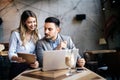 Cheerful coworkers in office working and brainstorming together Royalty Free Stock Photo