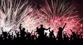 Cheerful crowd of people watching a salute, firework. Celebration, feast, holiday.