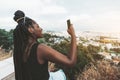 Black girl photographing cityscape Royalty Free Stock Photo