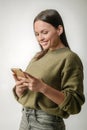 Cheerful cute woman with smartphone
