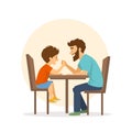 Cheerful cute father and son arm wrestling