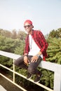 Cheerful dark skinned young guy wearing sunglasses Royalty Free Stock Photo