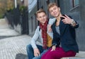 Cheerful day of twin brothers. Two stylish and handsome adult tw Royalty Free Stock Photo