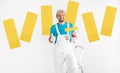 Cheerful decorator with paint roller showing thumb up Royalty Free Stock Photo