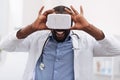 Cheerful delighted doctor using virtual reality glasses