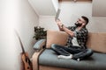 Cheerful delighted man holding a laptop in his hands