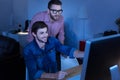 Cheerful delighted programmer smiling