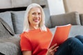 Cheerful delighted woman being in a positive mood