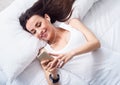 Cheerful delighted woman resting in bed Royalty Free Stock Photo