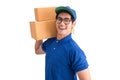 Cheerful delivery man. Happy young courier holding a cardboard box Royalty Free Stock Photo