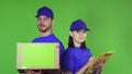 Cheerful delivery workers with a package smiling to the camera Royalty Free Stock Photo