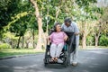 Cheerful disabled grandfather in wheelchair welcoming his happy Royalty Free Stock Photo