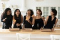 Cheerful diverse young ladies laughing sharing takeaway pizza Royalty Free Stock Photo