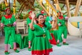 Cheerful diversity male and female group of christmas elves dancing during celebration party