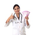 Cheerful doctor woman holding Indian 2000 rupee notes with thumb up gesture Royalty Free Stock Photo