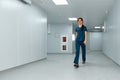 Cheerful doctor woman walks along the corridors of the clinic. Royalty Free Stock Photo