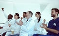 Cheerful doctors applauding during conference in clinic Royalty Free Stock Photo