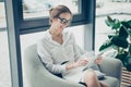 Cheerful dreamy economist layabout in formal wear, sitting at co Royalty Free Stock Photo