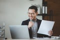 Cheerful due to success in work, Entrepreneurs joyful because business is prospering, Businessman working happily in office at Royalty Free Stock Photo