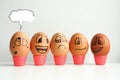 Cheerful eggs in a row, lined