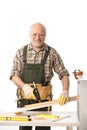 Cheerful elderly man tinkering