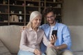 Cheerful elderly mother and happy young adult son taking selfie Royalty Free Stock Photo