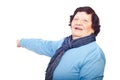 Cheerful elderly woman pointing to copy space