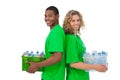 Cheerful environmental activists holding box of recyclables and Royalty Free Stock Photo