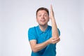 Cheerful european mature man ready to answer question isolated on a white background