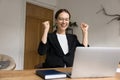 Cheerful excited winner business woman enjoying triumph, win Royalty Free Stock Photo