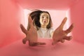 Cheerful and excited young girl looking inside carton box. Looking extremely happy Royalty Free Stock Photo