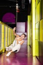 Cheerful girl swinging on indoor zip line at play center Royalty Free Stock Photo