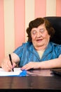 Cheerful executive elderly writting