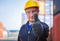 Cheerful factory worker man smiling with giving thumbs up as sign of Success Royalty Free Stock Photo