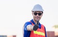 Cheerful factory worker man smiling with giving thumbs up as sign of Success Royalty Free Stock Photo