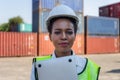 Cheerful factory worker woman in hard hat smiling and looking at camera, Happiness Female engineers for concept