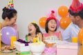 Cheerful family with cake and gifts at a birthday party Royalty Free Stock Photo