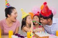 Cheerful family with cake and gifts at a birthday party Royalty Free Stock Photo