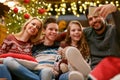 Family on Christmas holiday making selfie together