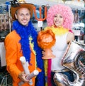 Cheerful couple choosing funny headdresses Royalty Free Stock Photo