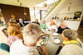 Cheerful Family Dinner in Modern Home with Conversations Royalty Free Stock Photo