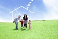 Cheerful family with a drawn house Royalty Free Stock Photo