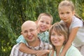 Cheerful family in early fall park Royalty Free Stock Photo