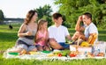 Cheerful family picnicking