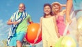 Cheerful Family Going to the Beach Holiday Enjoying Concept