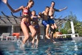 Cheerful family jumping to the seaside together